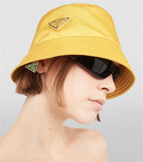 prada bucket hat brown|yellow Prada bucket hat.